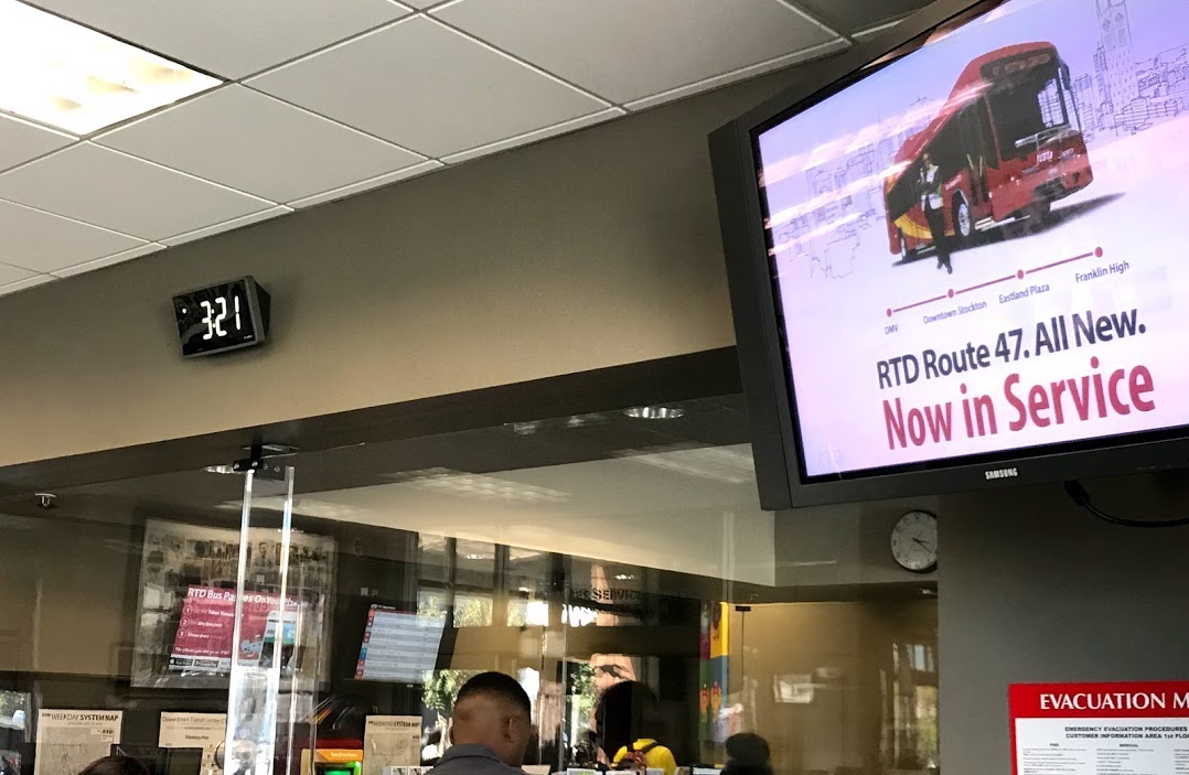 Digital signage display in the transit center lobby
